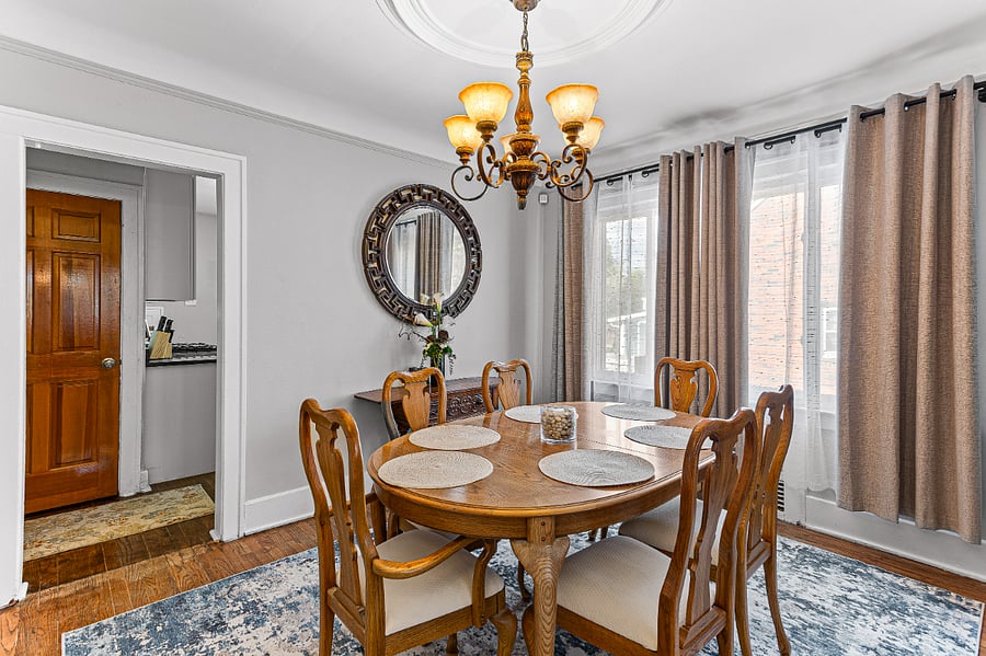 Apt. A Lower Flat
Large dining room.  Chandelier, oak table with two captain's chairs.  Seats 6 & has extra leaves available upon request.  Large windows with blackout curtains, shears, hardwood floors.  The door on the left goes directly to the private basement laundry facilities.