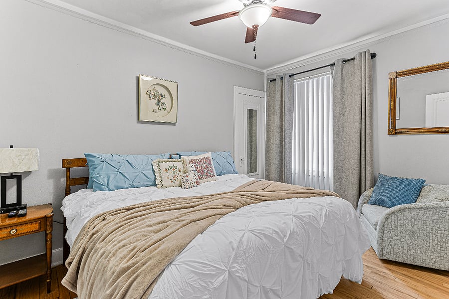 Apt. A Lower Flat Bedroom 2.  50 Smart TV, Roku.  Flexible bedding arrangement.  It can be arranged as a king width bed or it can be arranged to have two separate twin beds with fully encased magnetic therapy mattresses, new encased pillows, new bedding, blackout curtains, vertical blinds, large walk-in closet, dresser, touch lamp with charging station, ceiling fan, dresser, large mirror on closet door.