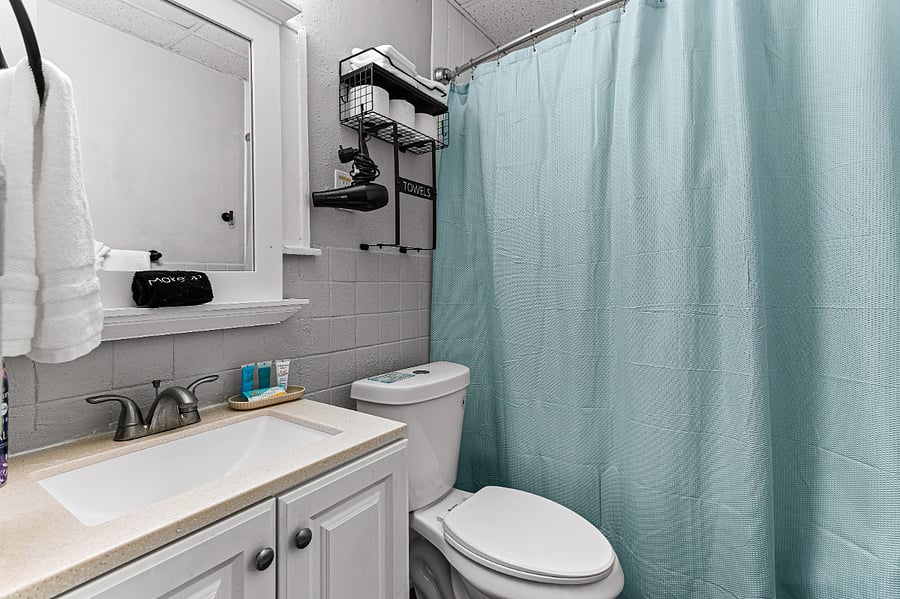 Apt. A Lower Flat Bathroom:  New granite countertop with under mount sink. Exhaust vent. New light fixture.
