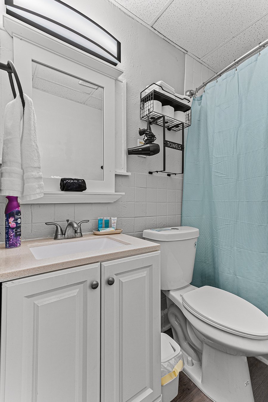 Apt. A Lower Flat Bathroom:  New granite countertop with under mount sink. Exhaust vent. New light fixture.