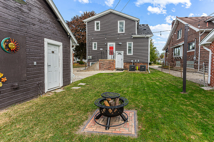 Shared outdoor space for Apt. A & B.  Festive outdoor lights. We have a fire pit.