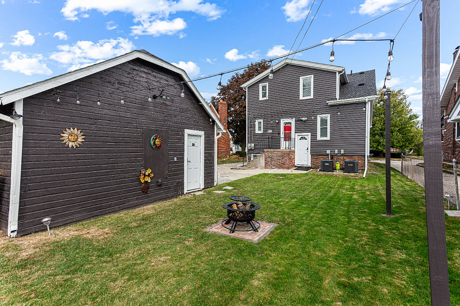 Winter view:
Shared outdoor space for Apt. A & B.  Festive outdoor lights. We have two firepits.  One is a gas firepit, the other is wood burning, a patio table, & a gas grill available upon request.