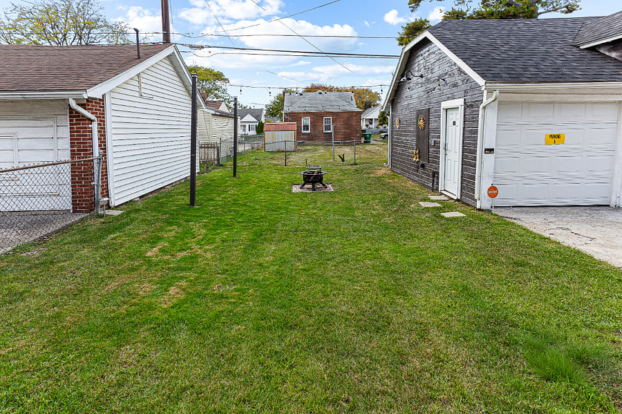 Winter view:
Shared outdoor space for Apt. A & B.  Festive outdoor lights. We have two firepits.  One is a gas firepit, the other is wood burning, a patio table, & a gas grill available upon request.