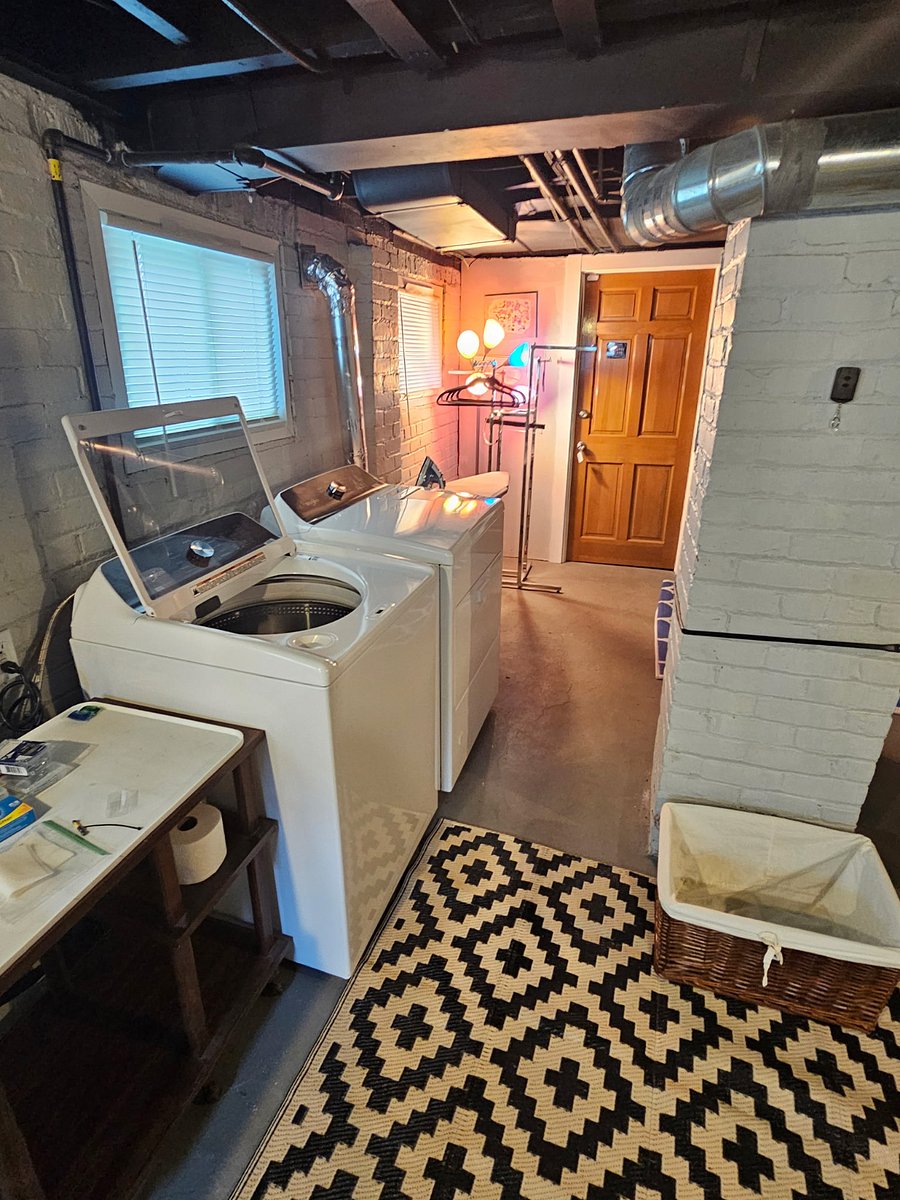 Private laundry center:
Bright basement with large windows allows for lots of natural light, new high efficiency washer & dryer.  Ironing board & new iron.  Large utility sinks.  Clothes rack to hang clean laundry.
