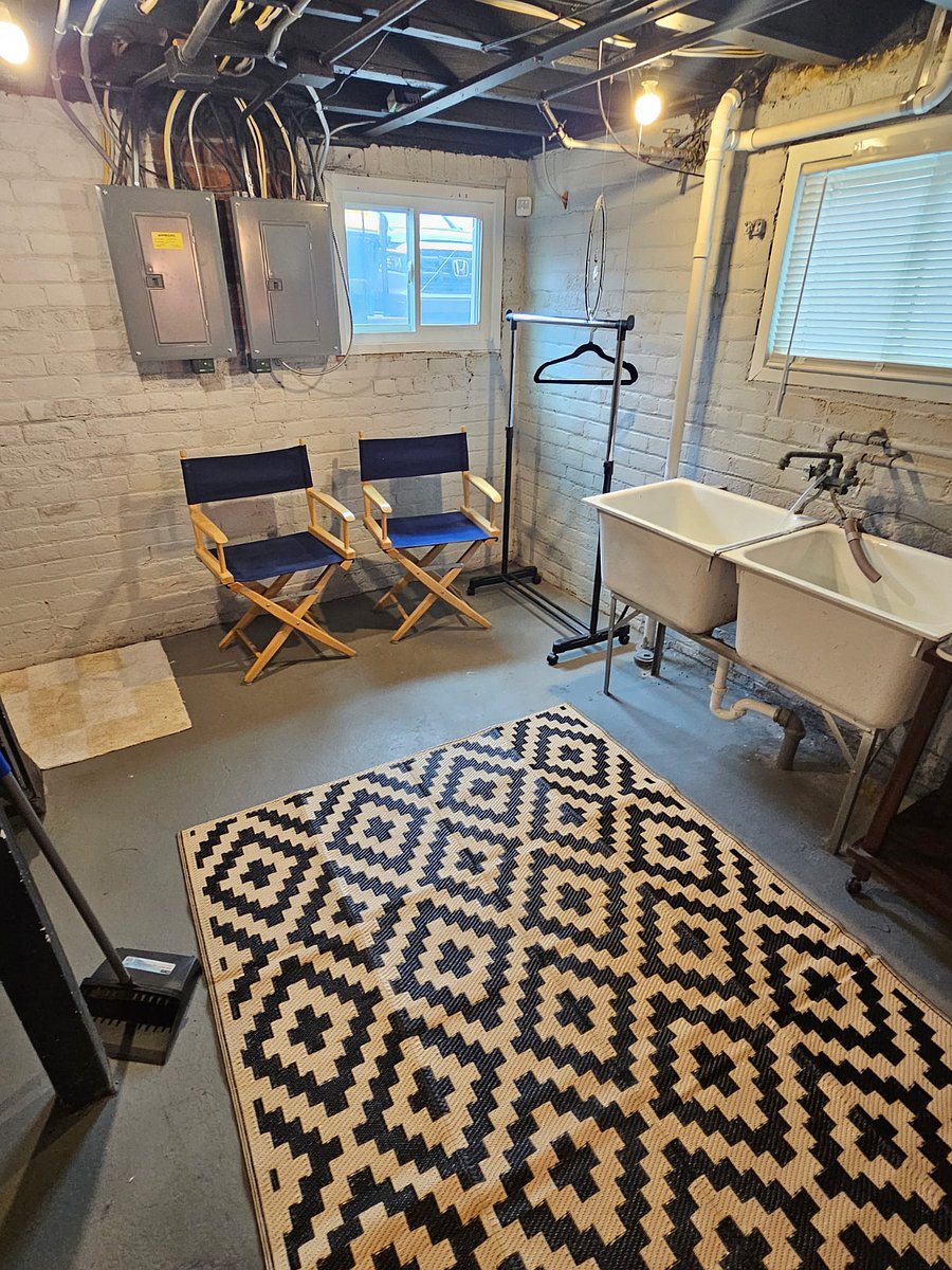 Private Laundry Center:
Bright basement with large windows allows for lots of natural light, new high efficiency washer & dryer.  Ironing board & a new iron.  Large utility sinks.  A place to hang your clothes as you do your laundry.