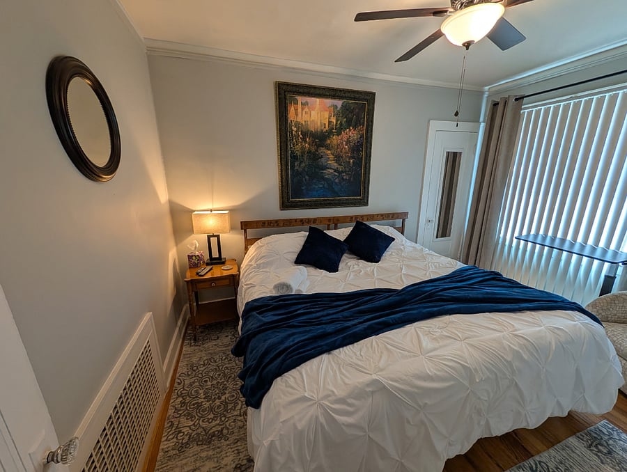 Apt. A Lower Flat Bedroom 2. 50 Smart TV, Roku. Flexible bedding arrangement. Bed dimensions are 76 wide x 75 long.
It can be arranged as a king width bed or it can be arranged to have two separate twin beds with fully encased mattresses, new encased pillows, new bedding, blackout curtains, vertical blinds, large walk-in closet, dresser, touch lamp with charging station, ceiling fan with light, dresser with attached mirror, large mirror on closet door.