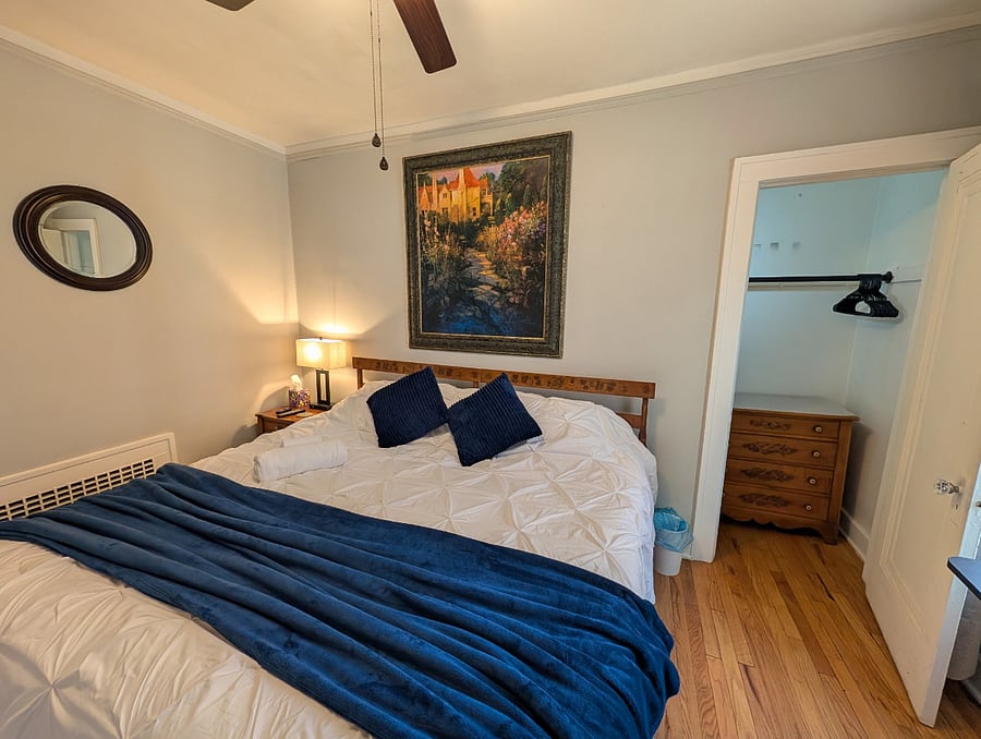 Apt. A Lower Flat Bedroom 2. 50Smart TV, Roku. Flexible bedding arrangement. Bed dimensions are 76 wide x 75 long.
It can be arranged as a king width bed or it can be arranged to have two separate twin beds with fully encased mattresses, new encased pillows, new bedding, blackout curtains, vertical blinds, large walk-in closet, dresser, touch lamp with charging station, ceiling fan with light, dresser with attached mirror, large mirror on closet door.