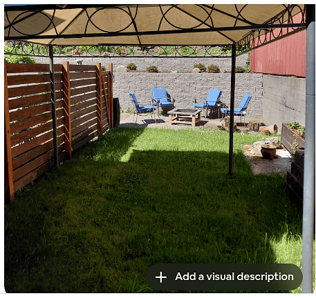 View to backyard which has retaining wall surrounds