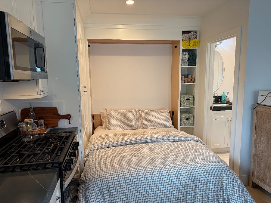 Murphy bed with new queen mattress that tucks away daily to keep studio tidy and spacious