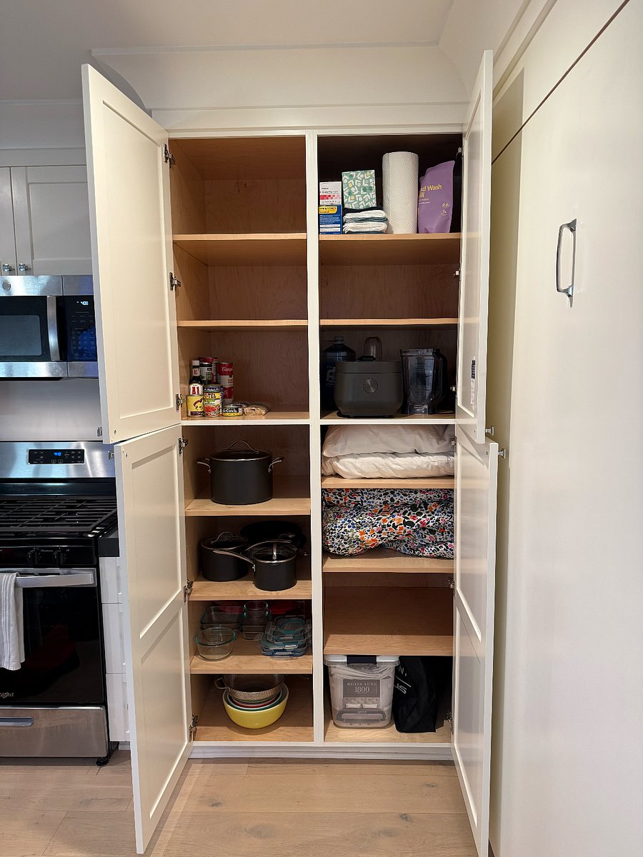 pantry and fully stocked kitchen items and bedding storage plus more room