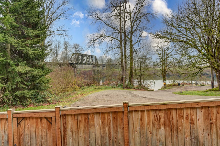 View of river and old train trestle from living and dining room.