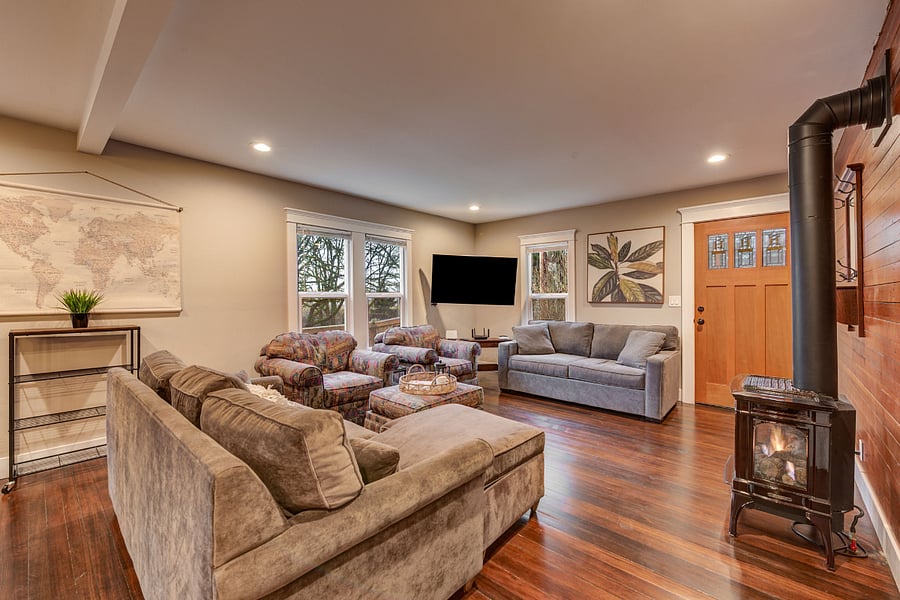 View of living room towards front door. Cozy gas fireplace heats the space nicely.