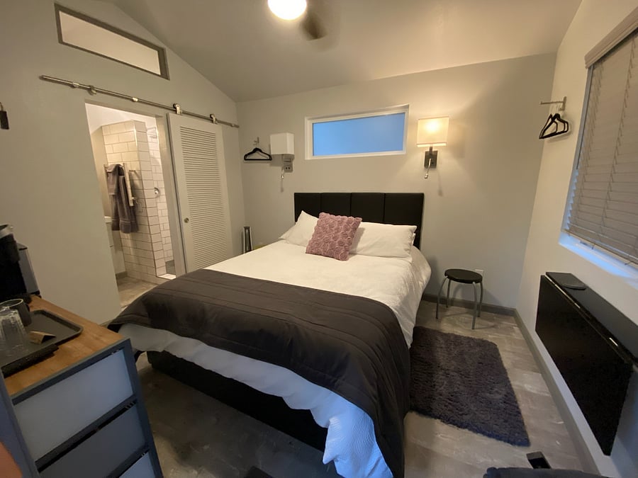 Welcome in. Plenty of light to choose from, a ceiling fan, and 2 sconces with reading lights. 