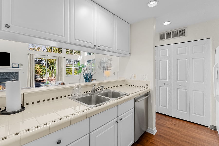 New LG WashTower Stacked SMART Laundry Center conveniently located off the kitchen, neatly concealed behind bifold doors.
