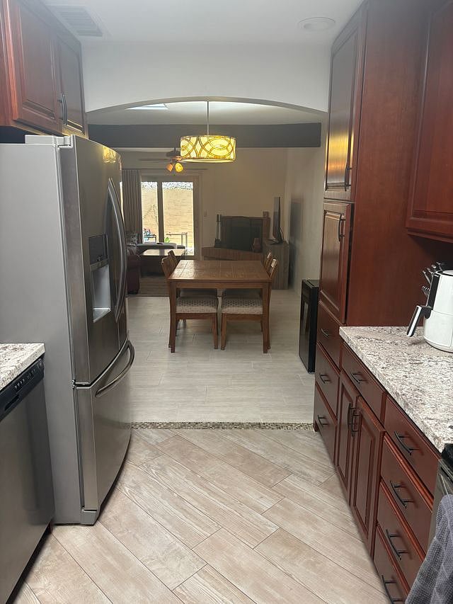 Walk in through car port kitchen and view.