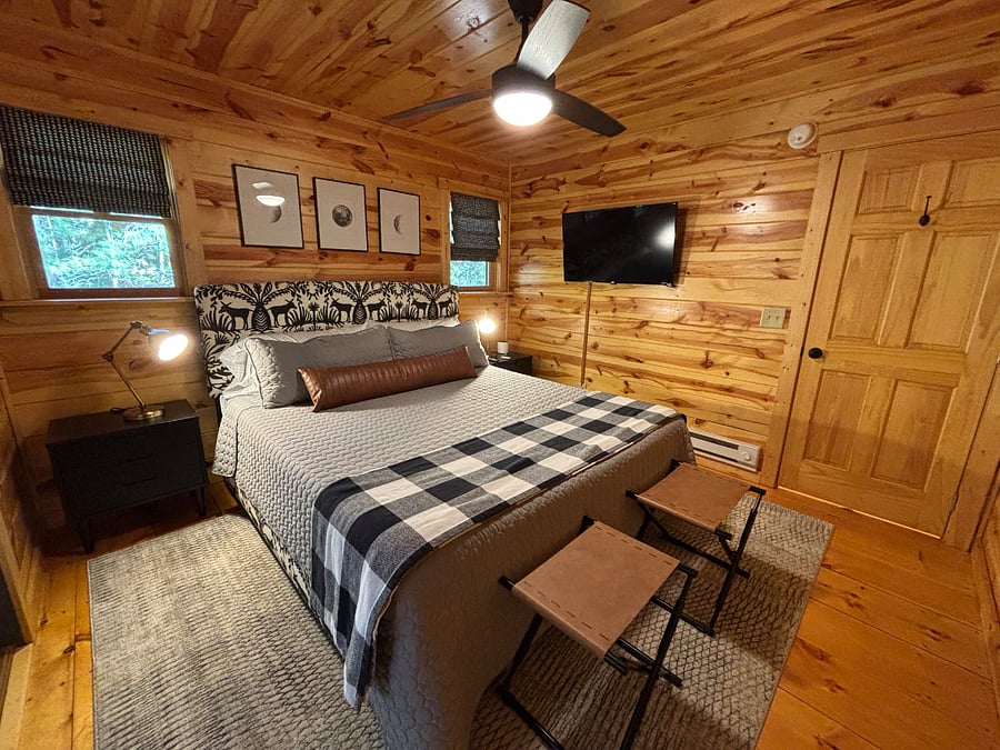 Serene king bedroom w/ patio access, smart TV, and a luxurious Nectar mattress.