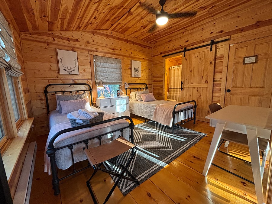 Cozy upstairs bedroom with two twin Nectar beds, writing desk, & private bath.
