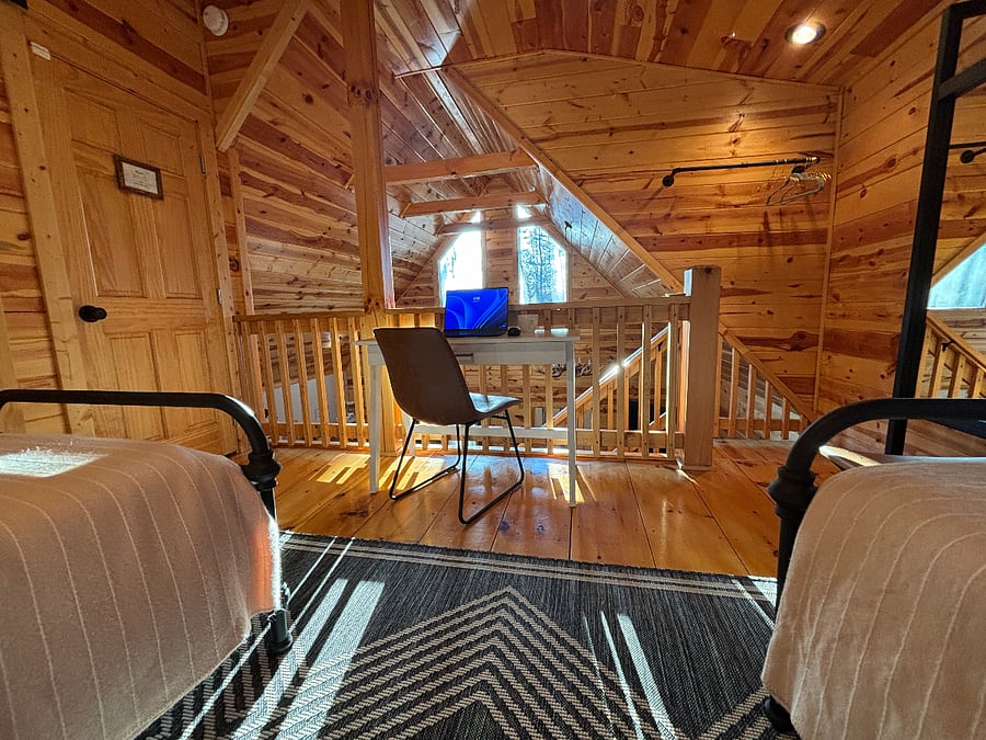 Cozy upstairs bedroom with two twin Nectar beds, writing desk, & private bath.