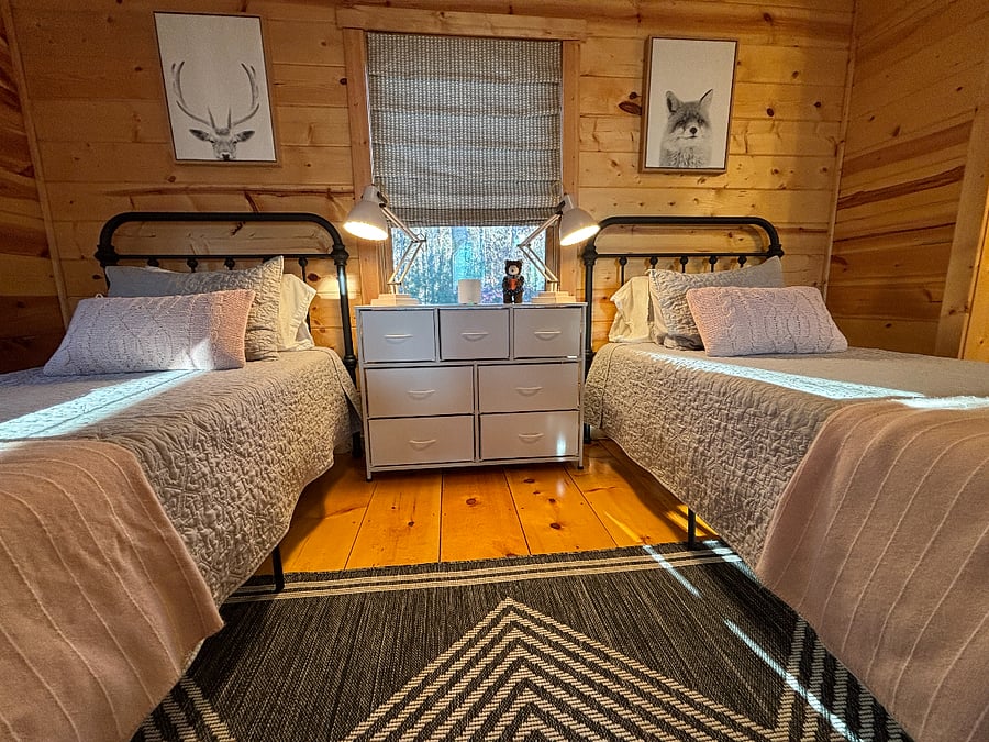 Cozy upstairs bedroom with two twin Nectar beds, writing desk, & private bath.