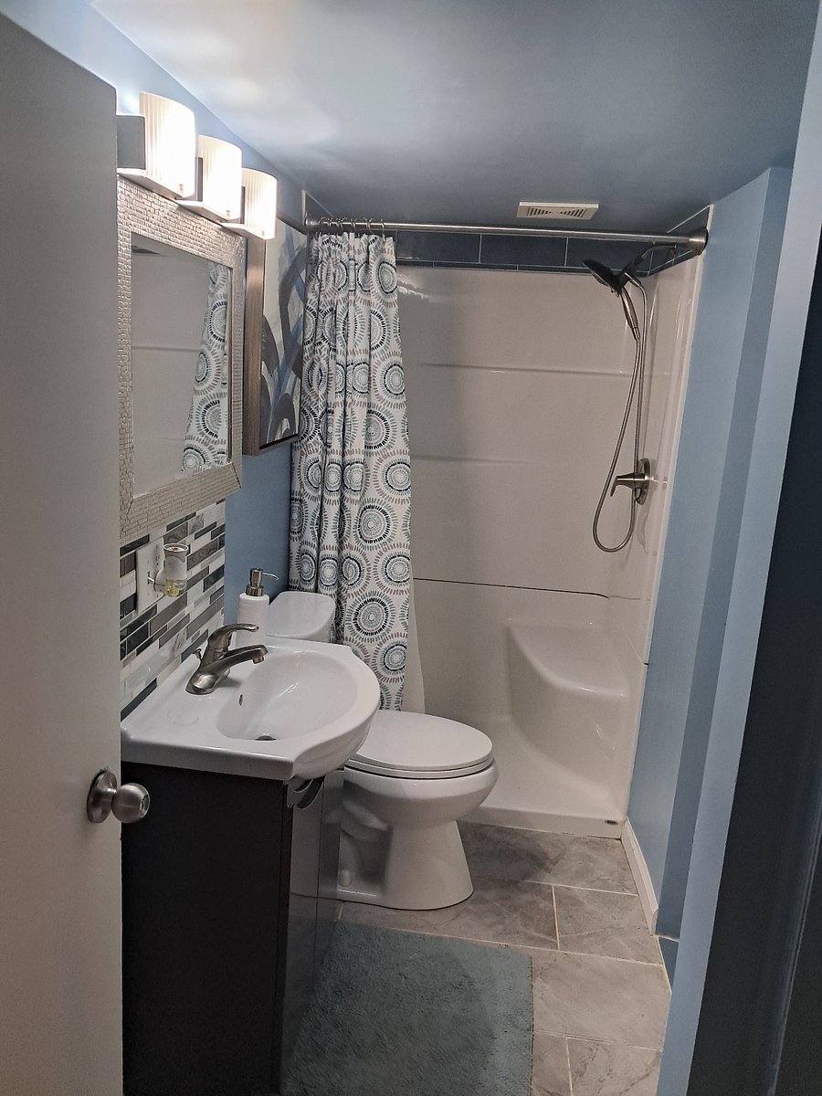 Newly updated walk-in shower with seat
