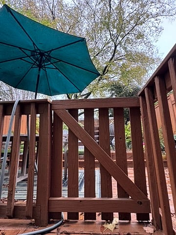This gate leads directly from your entrance/exit steps to the backyard deck.