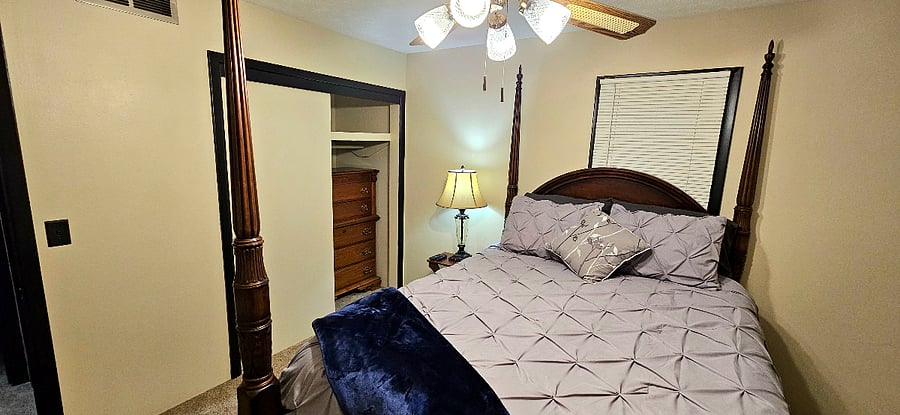 Master bedroom with ensuite and smart TV.