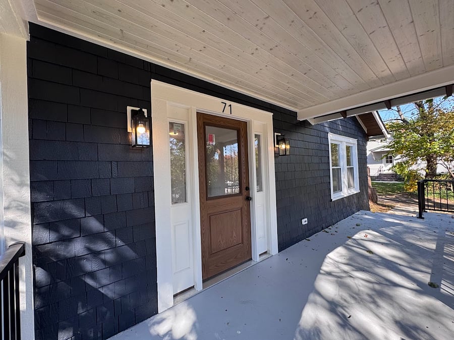 Front entrance on large, partially covered porch.