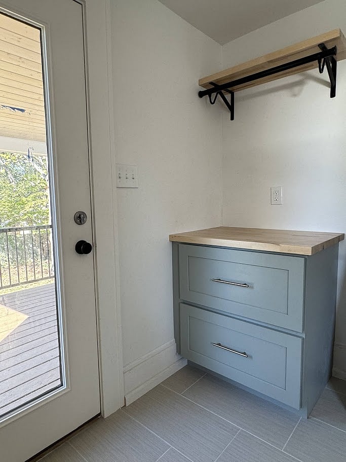 Storage drawers and folding/hanging counter for laundry.