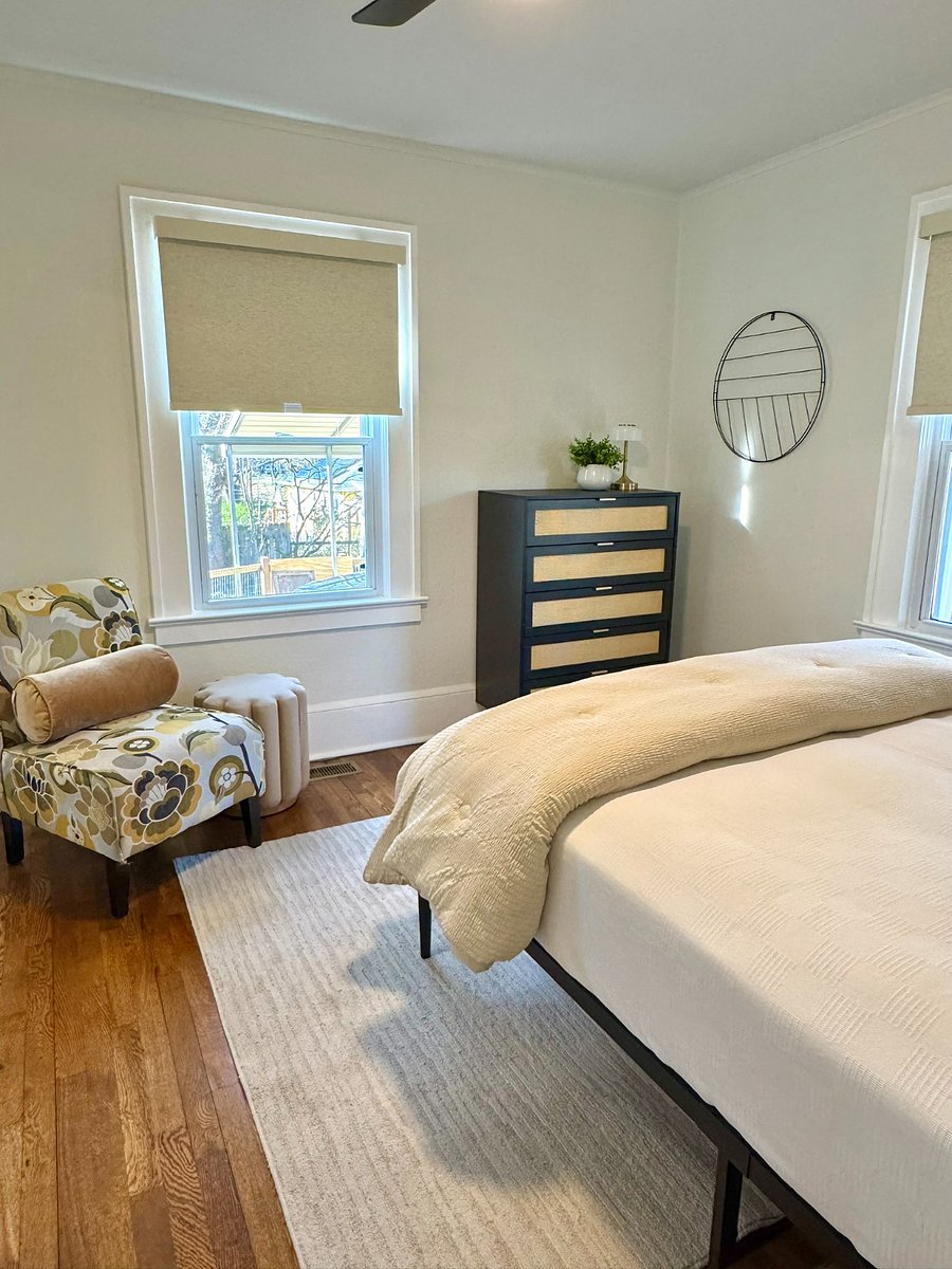 Bedroom 2 with Queen Bed, sitting area, TV on the way and large closet.