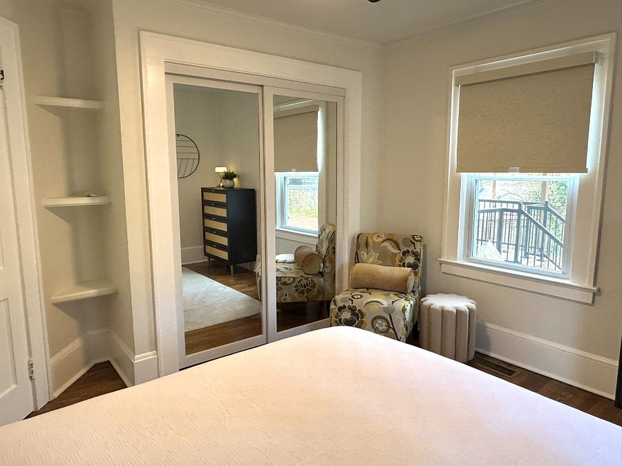 Bedroom 2 with Queen Bed, sitting area, TV on the way and large closet.