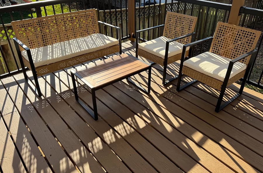 Large, covered back deck with sitting furniture to relax as the sun goes down.