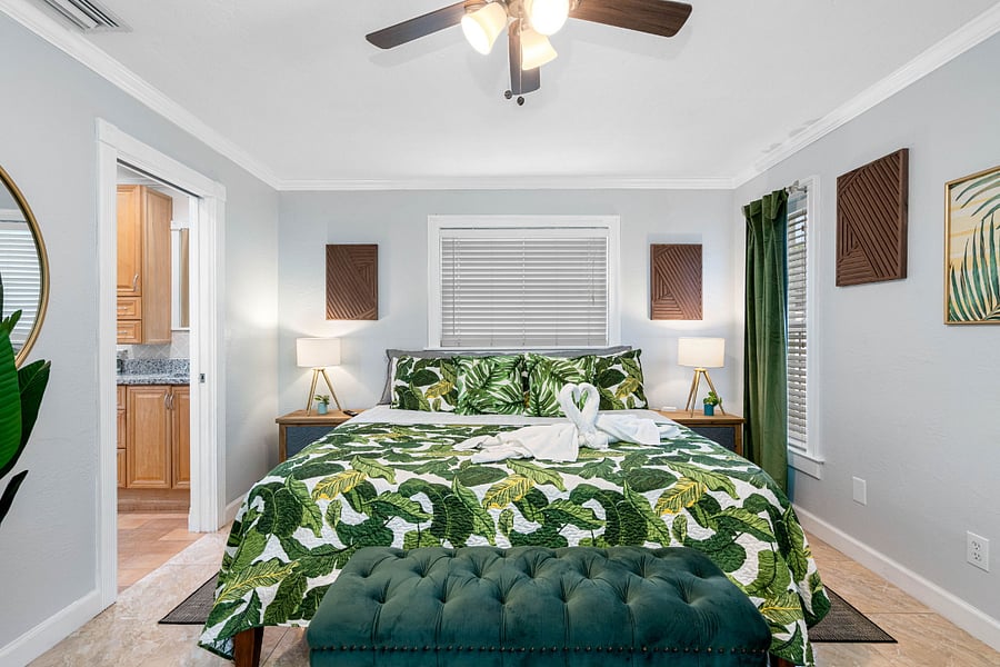 Master bedroom with the King size bed and in-suite half bathroom, smart TV