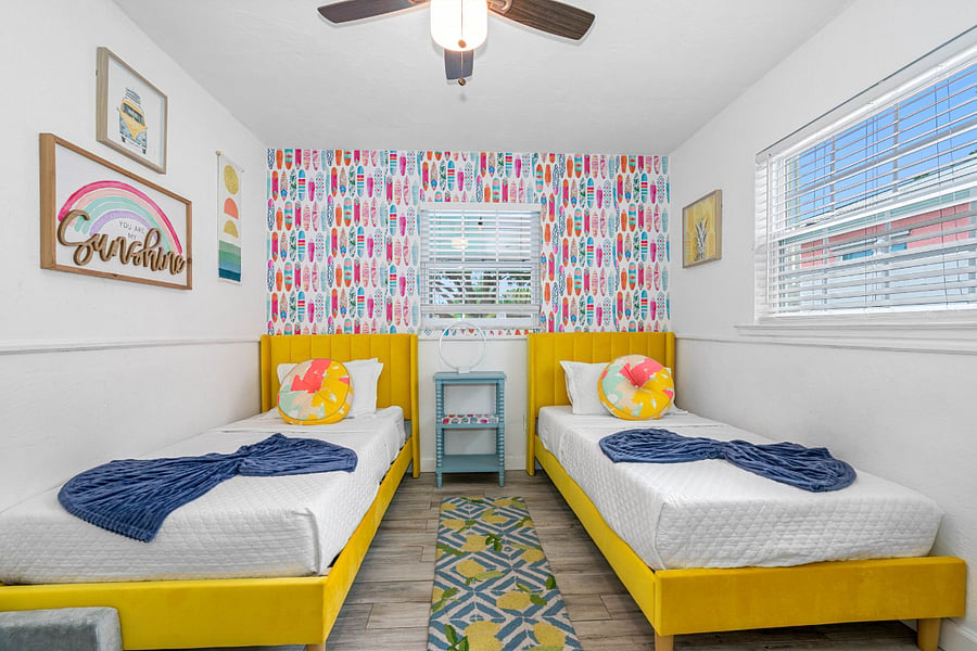 third bedroom with two twin beds and a closet