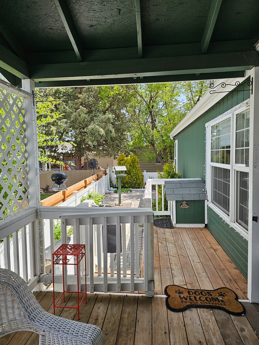 Doggie deck and stairs go down to the fenced backyard.