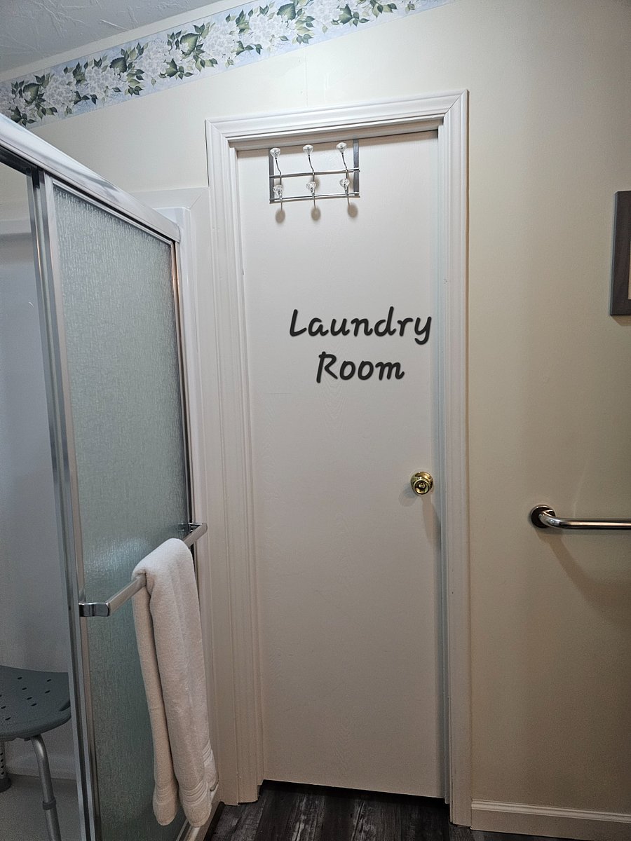 Bathroom exits to laundry room and garage