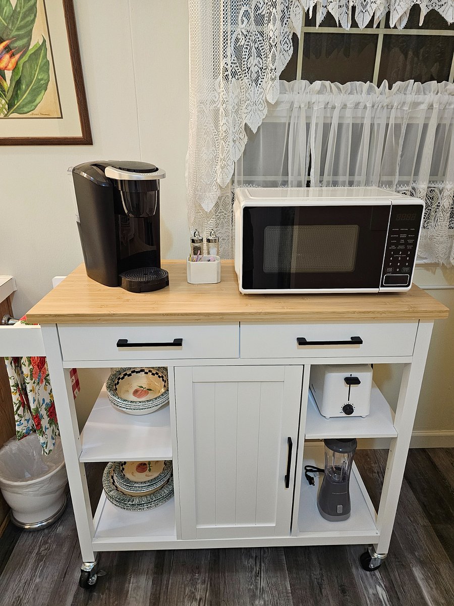 Chef's cart with dishes, cups, glasses, plates, bowls, coffeemaker and/or keurig, (coffee provided)  toaster, blender, microwave and condiments.