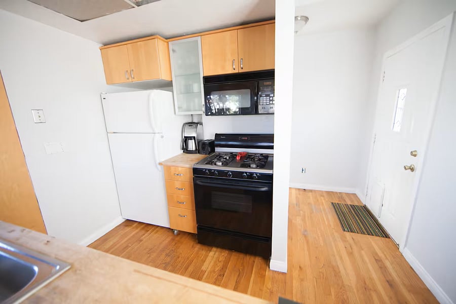 gas stove top and full fridge