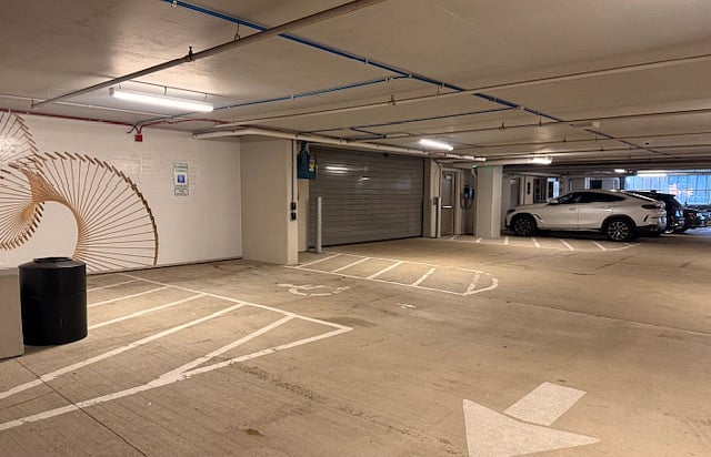 Garage Door to Guest Parking Area to Upper Level Heated Private Resident Garage