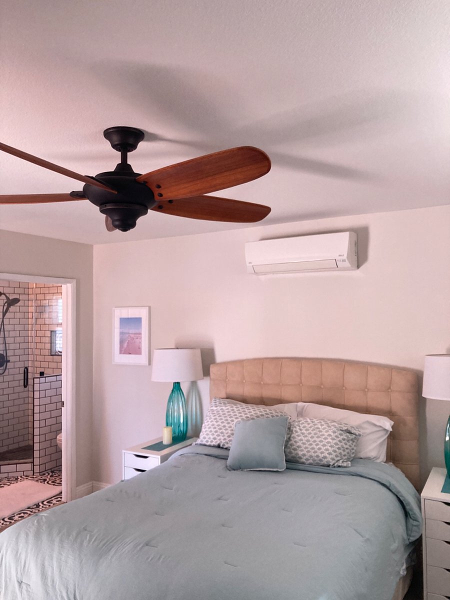 Queen bed air conditioning and heater above.