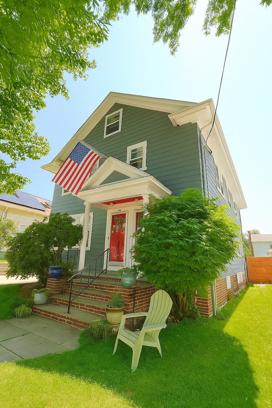 Charming 1920s owner-occupied two-family home with classic details and welcoming curb appeal.
