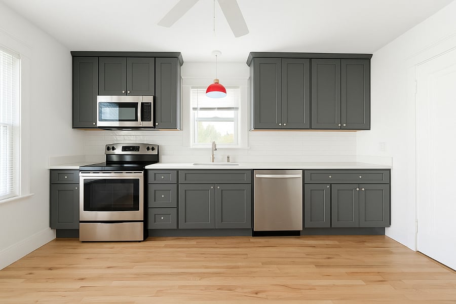 Brand-new kitchen with dove-gray soft-close shaker cabinets, quartz countertops, and stainless steel appliances.