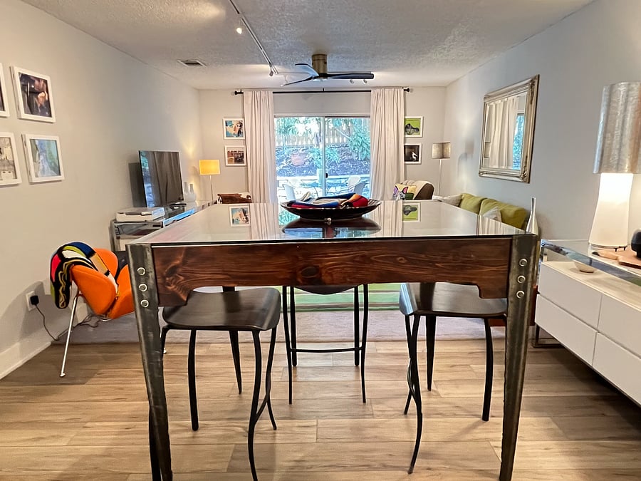 The Dining has a custom table commissioned by the owner to incorporate a historic window.