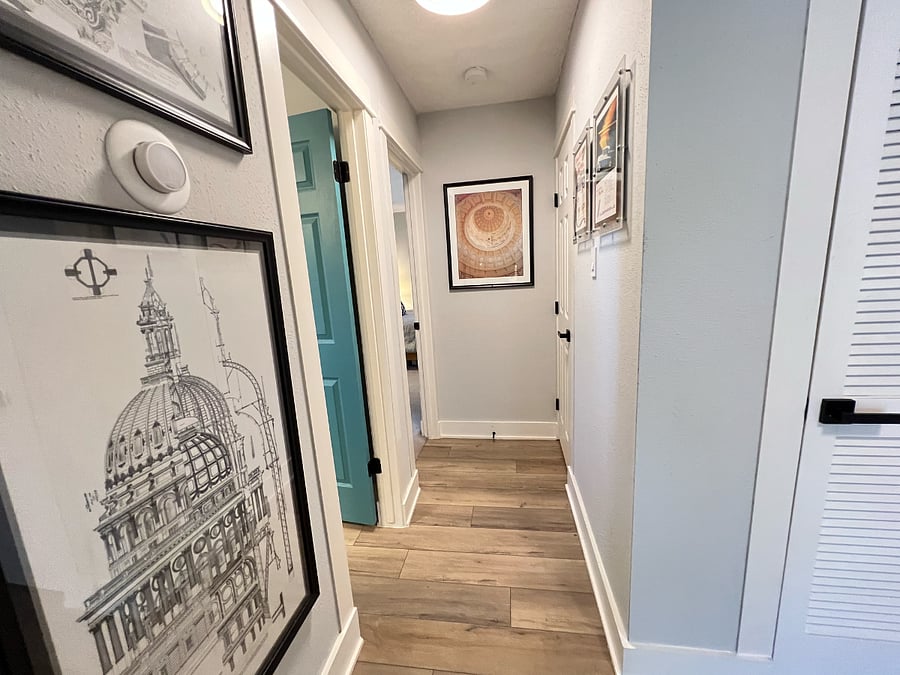 Eclectic art and photography in the Hallway. You will find 2 additional large closets in directly off of the Hallway as well.