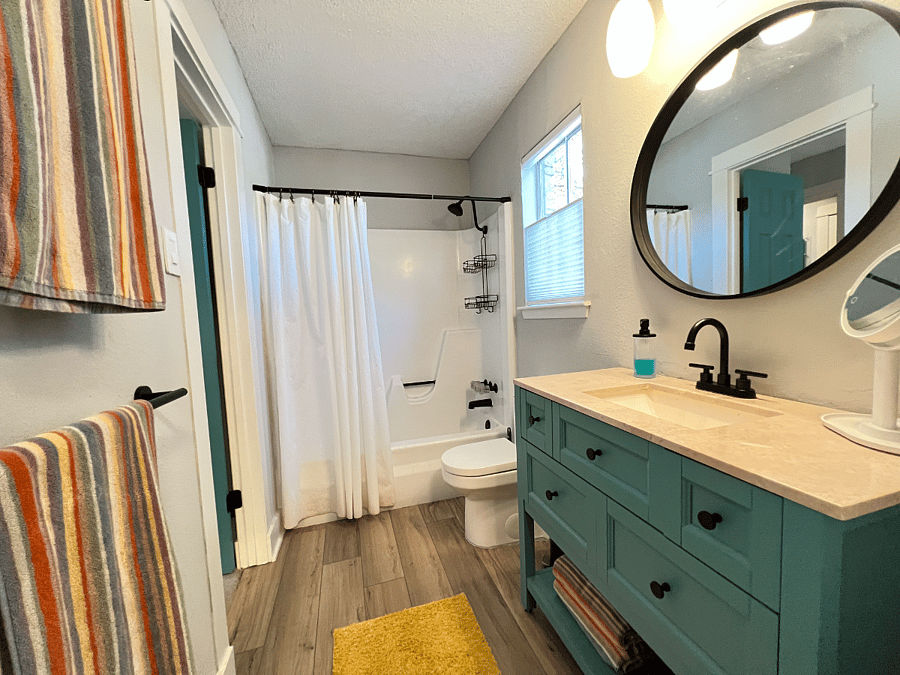 Master Bath with window adjacent to a large shade tree.