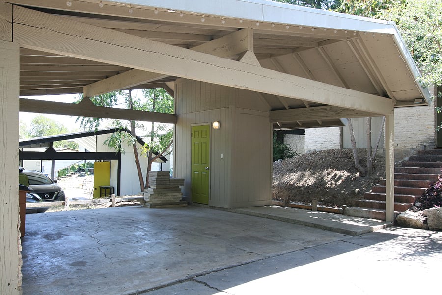 This is the 2-car Carport with Storage and Laundry Room. It is about 6' above Elmhurst Street a few steps down from the house.