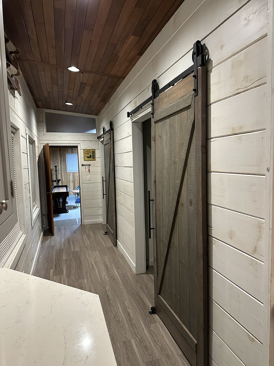 Authentic shiplap w/ custom Barn doors hung on soft close tracks. Bedroom 1 and 2, entrry hallway to Bonus Room