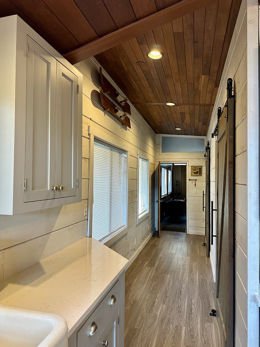 Towards the back of the house high vaulted ceiling's, can lights and large windows give plenty of light to the indoors.