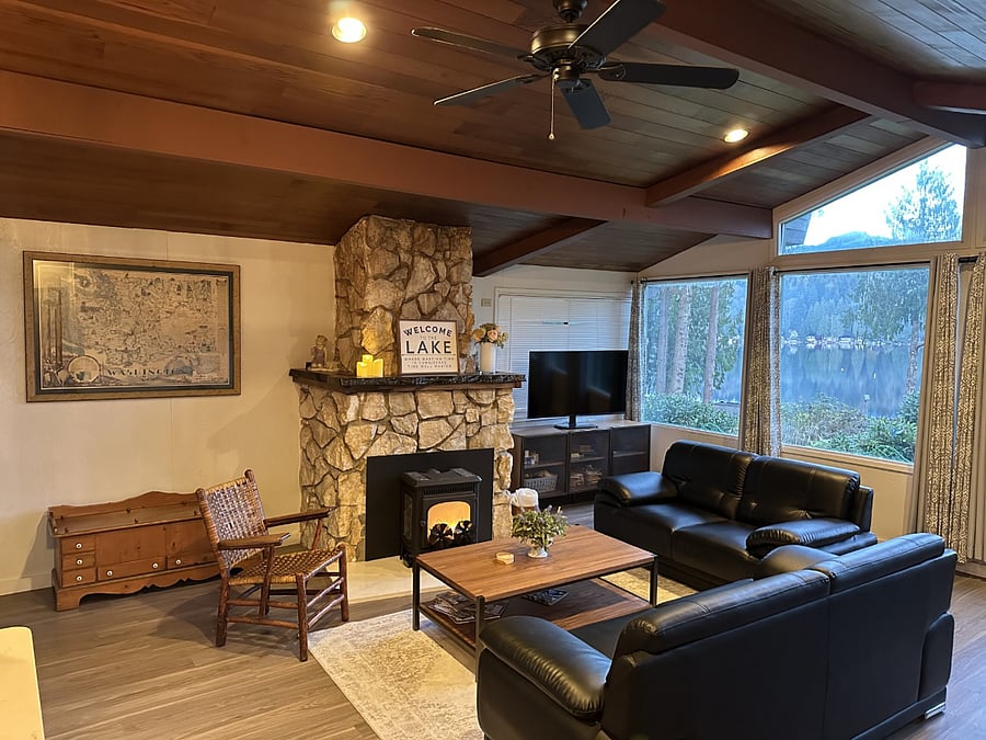 Scandinavian Spaces coffee table and Console cabinet w/ pair of sofas and area rug. Bear Wallow Chair, Montana White Marble Fireplace with Live Edge mantle