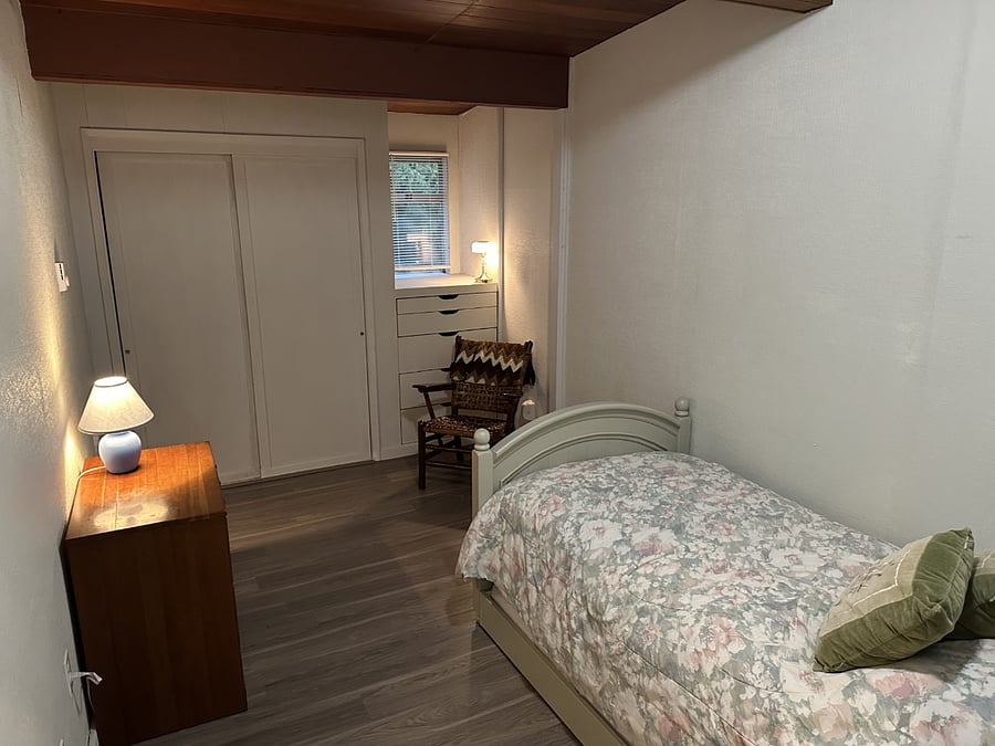 Twin Crate & Barrel bed w/ matching Trundle & Cherry Dresser. Built in dresser cabinet and closet w/ interior shelving