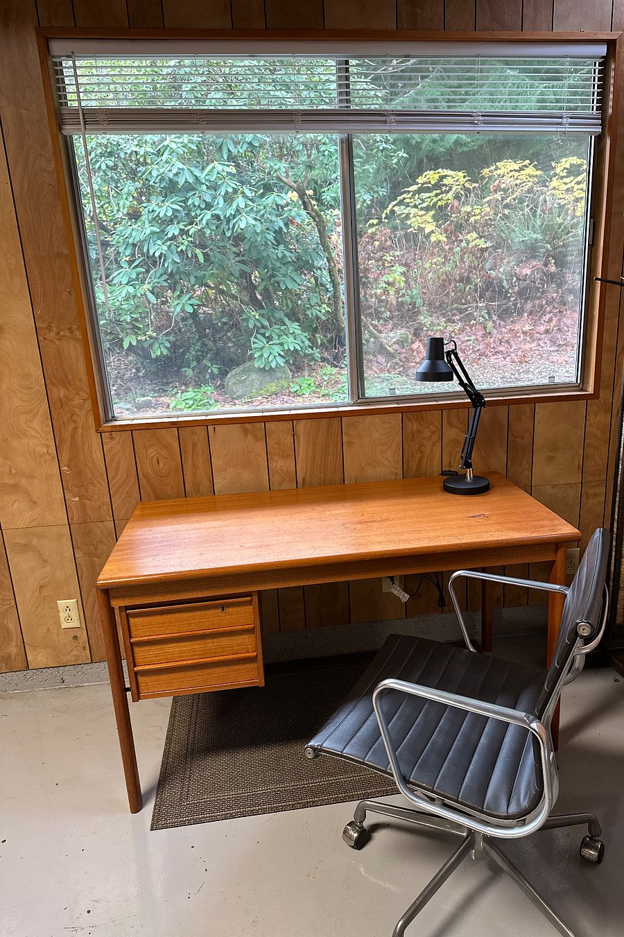 Vintage Danish Modern is the theme of this generouse home office space. Great light and a Herman Miller chair equal comfortable place to work.